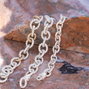 , , or ? Chain bracelets are great on their own or added to a stack. Add some gold links and your l