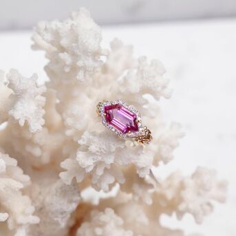 One of our newest additions! Get captivated by diamonds embracing the incandescent color of pink to