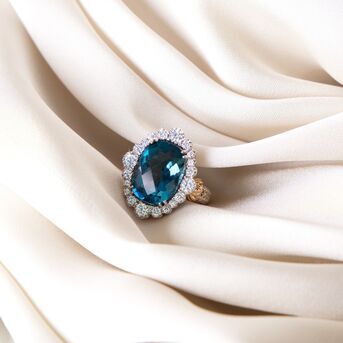 Designed so that you feel like a queen. The London Blue Topaz ring is handcrafted with sparkling di