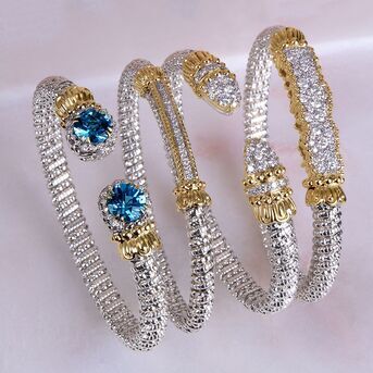 Luxury Bracelet Stack

Twotone gold and sterling silver bracelets embraced with diamonds 