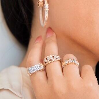 Make a statement in our iconic multi pav, butterfly, and croissant rings paired with the perfect ho