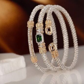 A Truly Exquisite Trio VAHANs open cuff, signature classic, and diamond bar bangle bracelets blend 